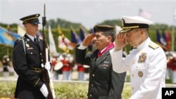 A man walks into the wind across the Hudson River from the skyline of New York in Hoboken, New Jersey, October 29, 2012. 