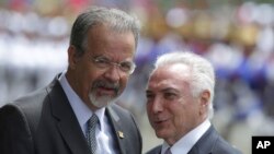 Brazil's President Michel Temer, right, talks with Defense Minister Raul Jungmann during his arrival to attend a meeting of the Defense Military Council, in Brasilia, Brazil, Feb. 22, 2018.