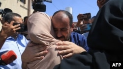 Al-Shifa hospital director Mohammed Abu Salmiya who was detained by Israeli forces since November, is welcomed by relatives after his release alongside other detainees, at Nasser hopsital in Khan Yunis in the southern Gaza Strip July 1, 2024, amid the ong