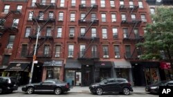 This photo shows 331, left, 333, center, and 335 East 9th Street in East Village neighborhood of New York, Aug. 31, 2018. The Kushner family real estate firm, which owns these buildings and others, has amassed more than half a million dollars in unpaid fines for various New York City sanitation and building violations, much of that bill incurred while President Donald Trump's son-in-law and adviser Jared Kushner was running the company. 