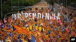 Pro-independence demonstrators fill up La Diagonal, one Barcelona's main avenues, during the Catalan National Day in Barcelona, Spain, Sept. 11, 2018. Catalan authorities called on supporters to flood the streets of Barcelona later in the day to demand freedom for Catalan politicians in jail and in support of independence from Spain. September 11, called "Diada," marks the fall of the Catalan capital to Spanish forces in 1714.