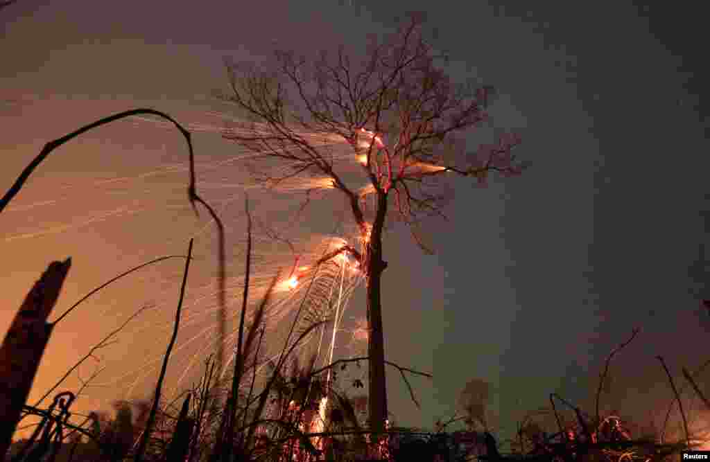A tract of Amazon jungle burns as it is cleared by farmers in Rio Pardo, Rondonia, Brazil 