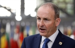 FILE - Ireland's Prime Minister Micheal Martin speaks to the media in Brussels, Belgium, Oct. 16, 2020.