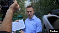 FILE - Russian opposition leader Alexei Navalny speaks with journalists in Moscow, Russia, Sept. 8, 2019.