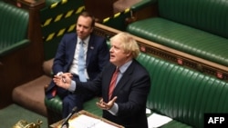 Britain's Prime Minister Boris Johnson attends Prime Minister's Questions (PMQs) in the House of Commons in central London, May 20, 2020, in this handout photograph released by the UK Parliament.