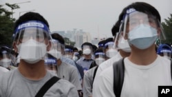 Interns and resident doctors attend a rally against the government medical policy in Seoul, South Korea.