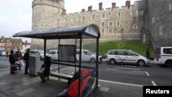 A sleeping bag and possessions of a homeless person are seen in a bus shelter opposite Windsor Castle in Windsor, Britain, Jan. 4, 2018. 