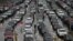 FILE -Cars wait to enter the United States from Tijuana, Mexico through the San Ysidro port of entry in San Diego, Dec. 25, 2014.