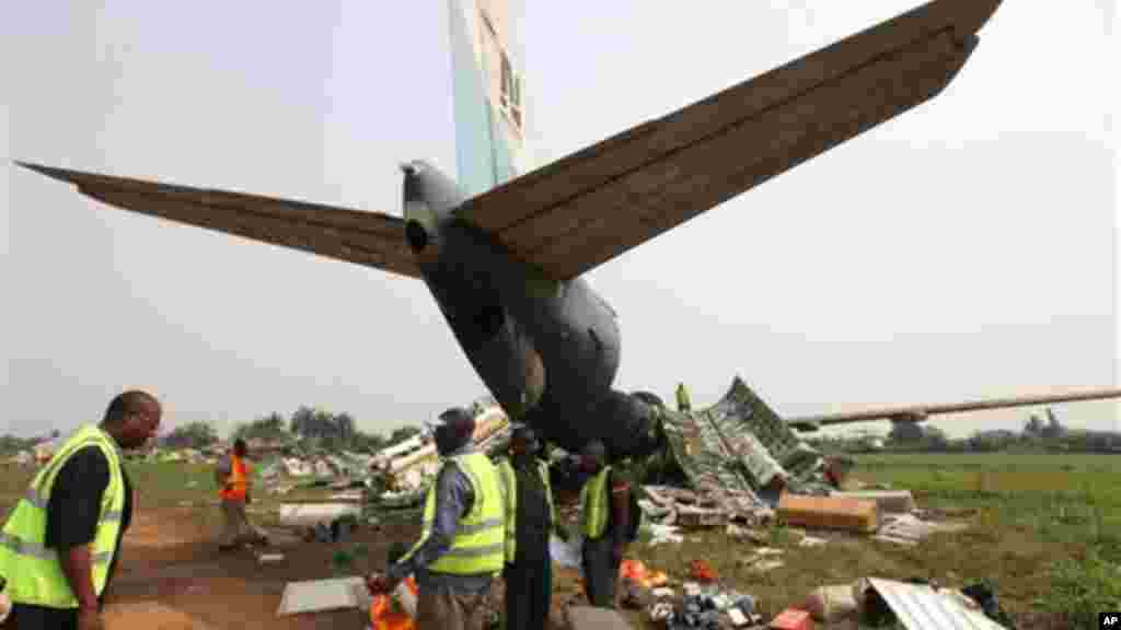 Workers dismantle an abandoned airplane at Murtala Muhammed International Airport in Lagos, Nigeria.