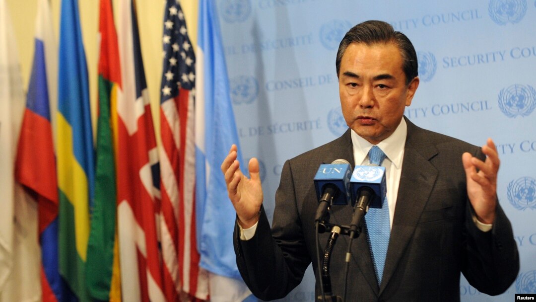 FILE - China's Foreign Minister Wang Yi speaks to members of the media after the U.N. Security Council meeting on Syria at the 68th United Nations General Assembly in New York.
