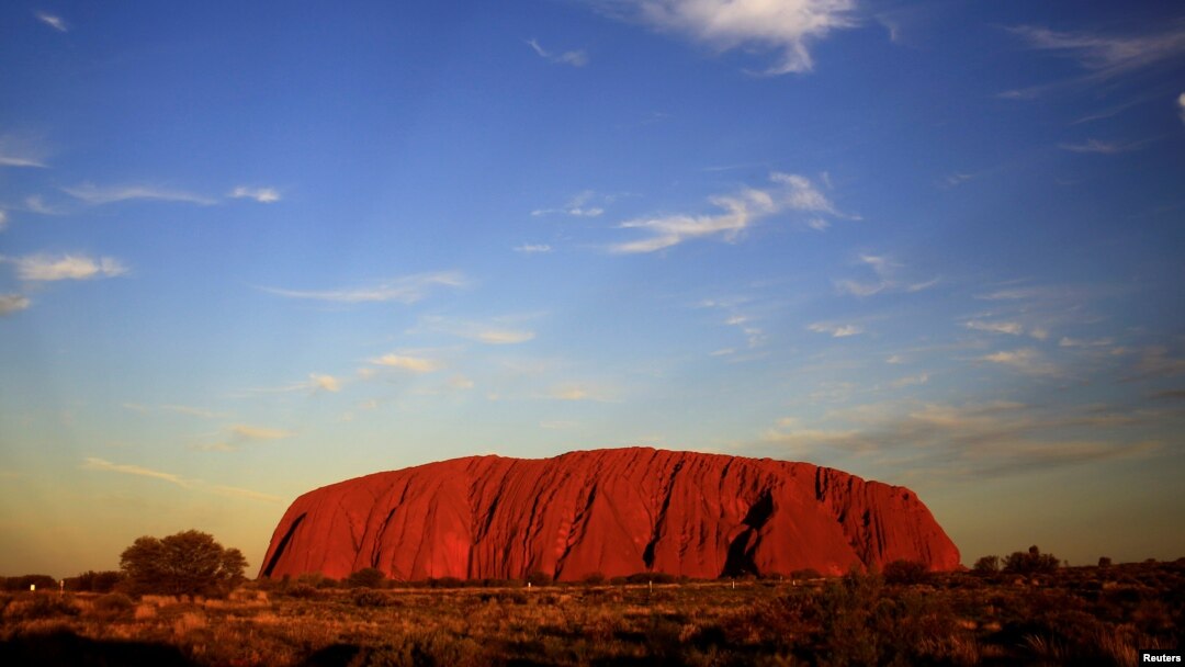 FILE: Uluru is lit by the setting sun in the Northern Territory in central Australia, April 21, 2014. 