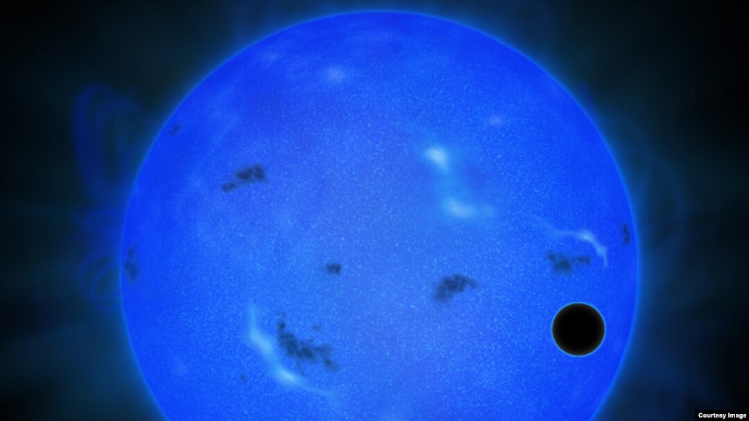 Artist's rendition of a transit of GJ 1214 b in blue light. The blue sphere represents the host star GJ 1214, and the black ball in front of it on the right is GJ 1214 b. (Credit: NAOJ)