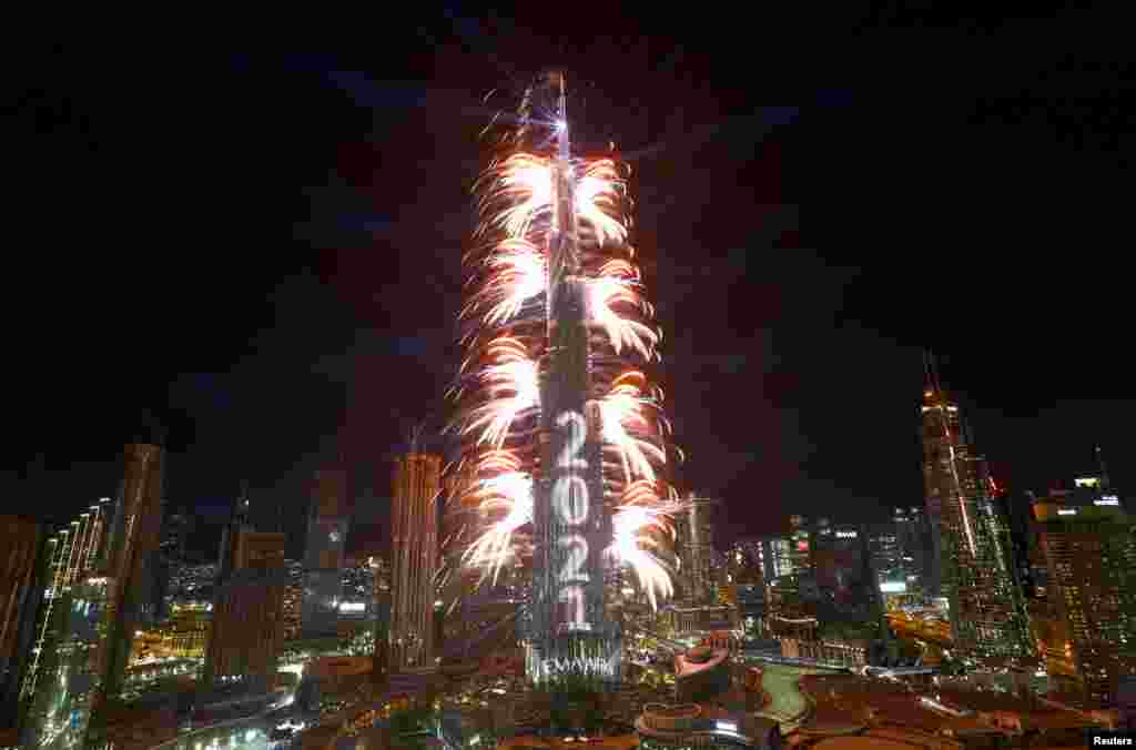 Fireworks explode from the Burj Khalifa, the tallest building in the world, during New Year&#39;s Eve celebrations in Dubai, United Arab Emirates, Dec. 31, 2020.