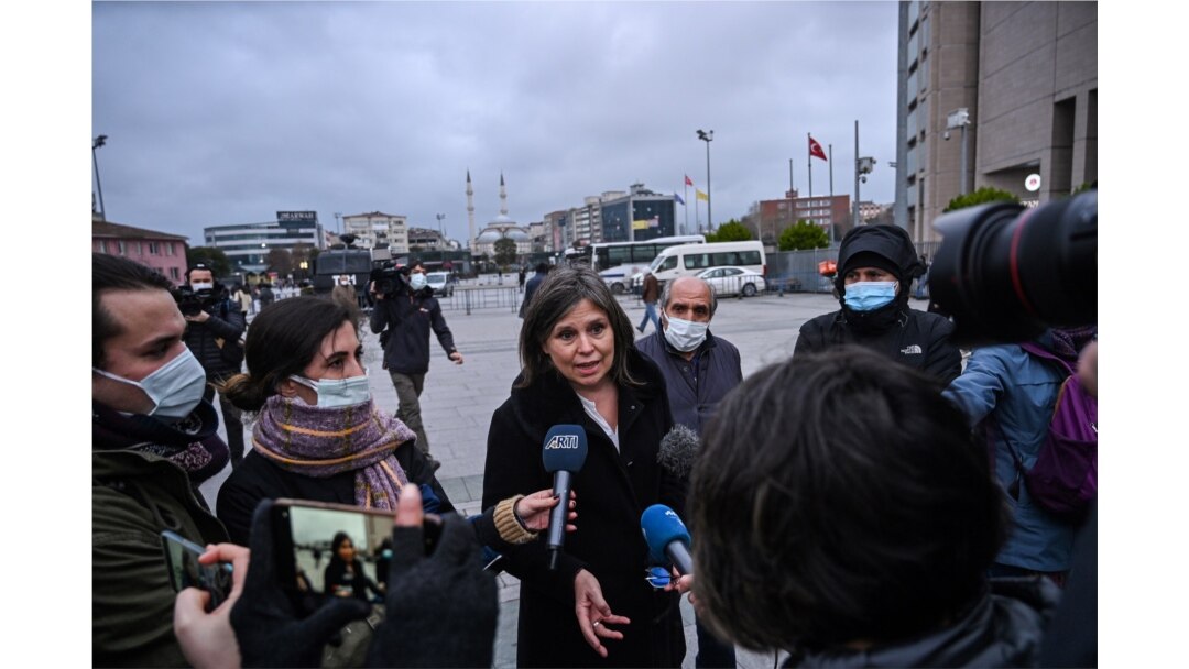 Human Rights Watch Turkey director Emma Sinclair-Webb, center, talks to the press on Dec. 18, 2020 in Istanbul after a hearing in the trial of jailed Turkish philanthropist Osman Kavala, on charges connected with a failed coup in 2016.
