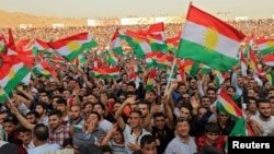 Kurdish people attend a rally to show their support for the upcoming Sept. 25 independence referendum in Duhuk, Iraq, Sept. 16, 2017.