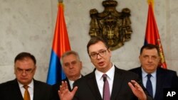 Serbia's Prime Minister Aleksandar Vucic, front, speaks during a press conference in Belgrade, Serbia, Feb. 22, 2017.