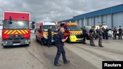 Members of French rescue services are seen in the port of Boulogne-sur-Mer after a boat carrying dozens of migrants capsized on its way across the English Channel to Britain, in Boulogne-sur-Mer, France, Sept. 3, 2024.