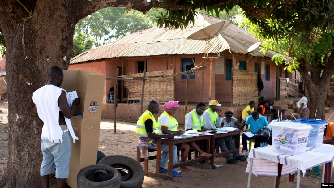 A man votes at a polling station in Bissau, April 13, 2014. 