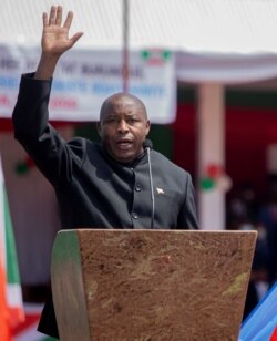 FILE - Burundi's President elect Evariste Ndayishimiye takes oath of office during his inauguration ceremony following the sudden death of his predecessor Pierre Nkurunziza, at the Ingoma stadium in Gitega, Burundi, June 18, 2020.