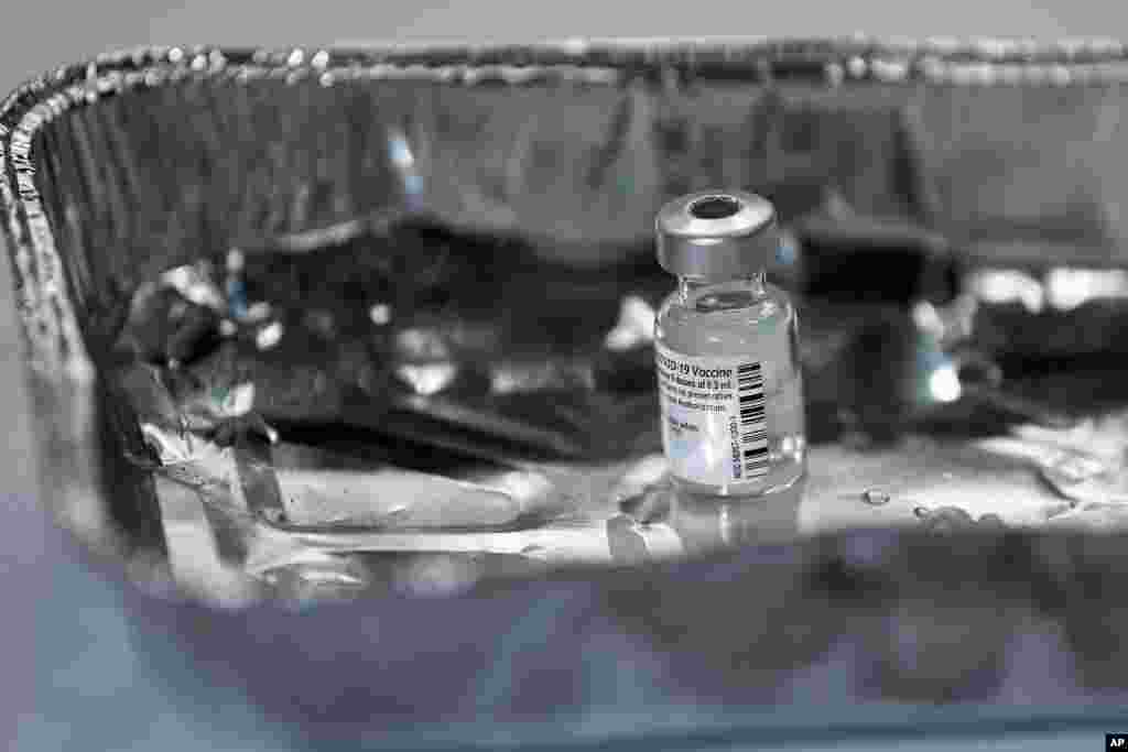 A vial of the Pfizer-BioNTech COVID-19 vaccine, as the mass public vaccination program gets underway, at the NHS Louisa Jordan Hospital in Glasgow, Scotland, Dec. 8, 2020. 