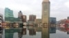 FILE - Baltimore is reflected in a still and icy Inner Harbor, Jan. 31, 2014. US President Donald Trump attacked Rep. Elijah Cummings, a Baltimore Democrat, and branded the majority black city of Baltimore an "infested mess," July 27, 2019.