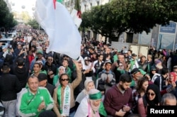 Demonstrators shout slogans during an anti-government rally in Algiers, Algeria December 27, 2019. REUTERS/Ramzi Boudina